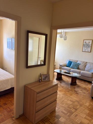 a living room with a couch and a table at Sweet dreams apartment in Bar