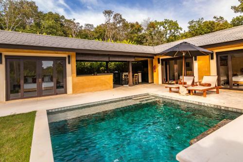 an image of a swimming pool in front of a house at Alanta Private Pool Villa in Ko Lanta