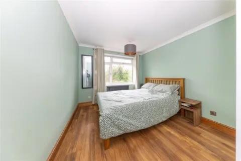 a bedroom with a bed and a window at Entire 3 bedroom house in Luton