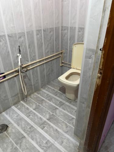a bathroom with a toilet in a room at Lara Homestay duplex 1bhk in Secunderabad