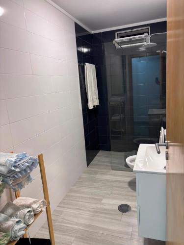 a bathroom with a sink and a toilet in it at Casa Costa in Esmoriz