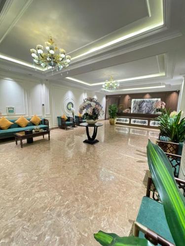 a large living room with couches and a table at Grand Hotel & Spa Bac Ninh in Ðồng Ky