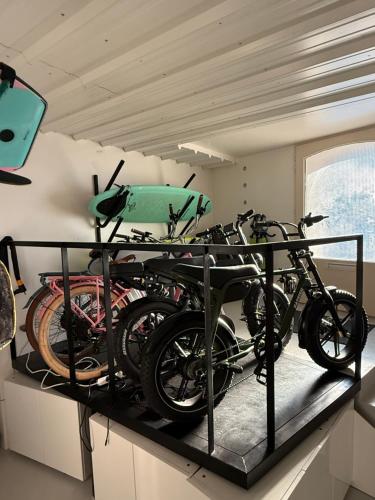 a group of bikes on a shelf in a room at Surf Sea and Sun in Biarritz