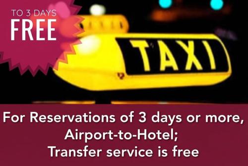 a yellow taxi sign with the words for reservations of days or more at Qorqud Hotel - Free Massage in Baku