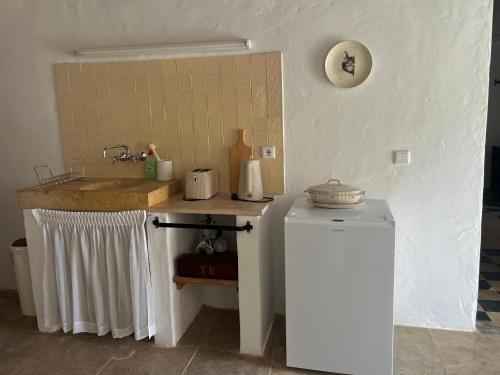 a kitchen with a sink and a counter top at Casa do Caseiro by Quinta da Burra in Cartaxo