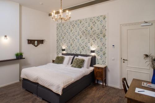 Letto o letti in una camera di Boutique Hotel De Blauwe Pauw