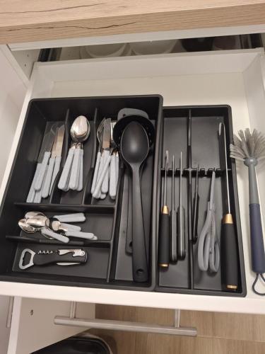 a drawer filled with utensils in a kitchen at Villa Ivana in Koper