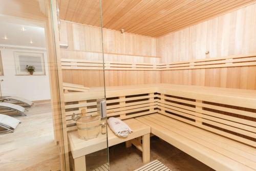 a sauna with a bench in the middle of it at Hotel Garni Brugger in Lindau