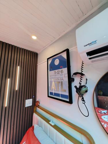 a room with a bed and a mirror at World Solo Travel's Welcomed At St Pete Home in St. Petersburg