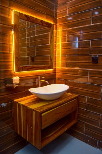 a bathroom with a sink and a mirror at N-line Residency Hotel in Arusha