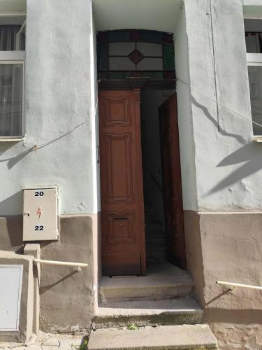 an entrance to a building with a wooden door at Cozy studio near the Hot Spring in Karlovy Vary