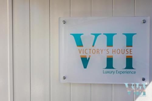 a sign for a wirneys house on a wall at Victory's Luxury House with Jacuzzi on the Roof in Casamicciola Terme
