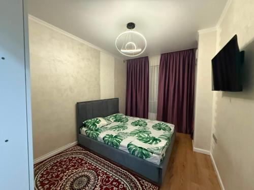 a bedroom with a bed in a room at Жилой Комплекс Kemel-UI in Qaskeleng