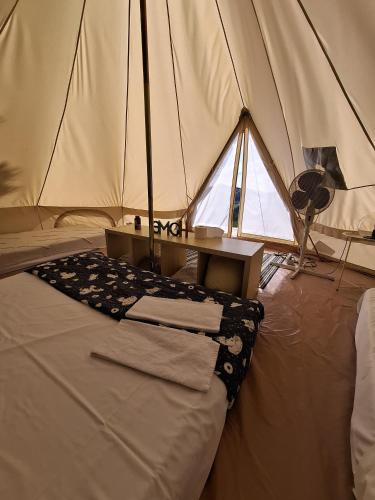 a room with a tent with a bed and a fan at Agriturismo La Taverna in Fontanelice