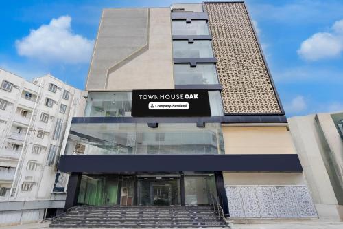 a building with a tumulus bank sign on it at Townhouse Oak AECS Layout Brookfield in Bangalore