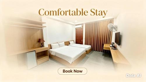 a white bedroom with a bed and a television at Hanoi Discovery Travel Hotel in Hanoi