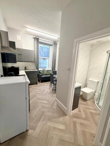 a room with a kitchen and a living room at Homely Away in Plymouth