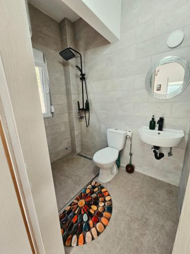 a bathroom with a toilet and a sink at Hikers place in Sutomore