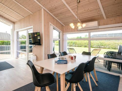 a dining room with a table and chairs at 4 star holiday home in Tarm in Tarm