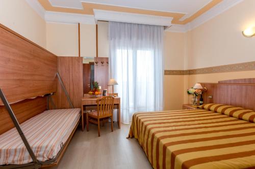 Cama o camas de una habitación en Hotel Smeraldo
