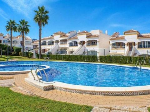 a swimming pool in front of a large house at Monte de Santa Pola in Gran Alacant