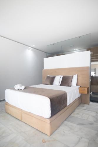 a bedroom with a large bed in a room at Playablanca Luxury Beach Apartment First Floor in Tanger in Tangier