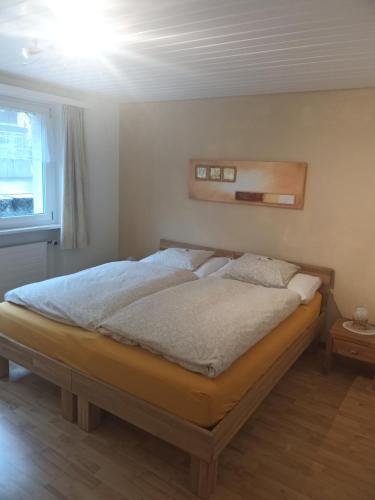 a bedroom with a bed in a room at Garten-Wohnung in Eschen