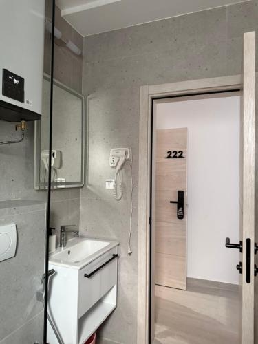 a bathroom with a sink and a shower at Apartments Vé in Budva