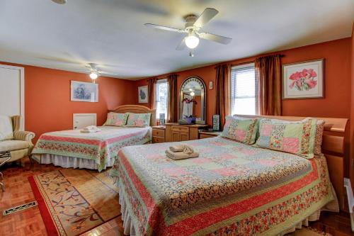 a bedroom with two beds and a ceiling fan at Williams Gate Bed & Breakfast Private Suites in Niagara on the Lake