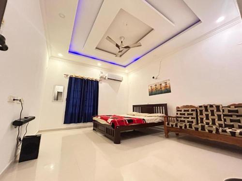 a room with a bed and a ceiling at Sandunes ReTreat Villa in Pondicherry