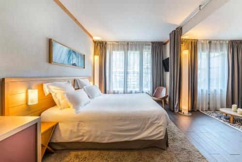 Кровать или кровати в номере Hotel Le Morgane