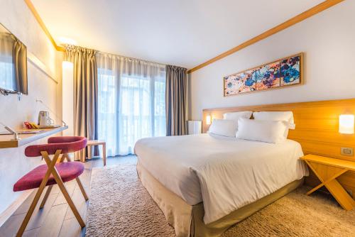 Кровать или кровати в номере Hotel Le Morgane