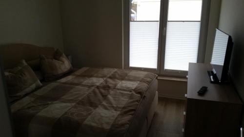 Ein Bett oder Betten in einem Zimmer der Unterkunft Hafenzauber