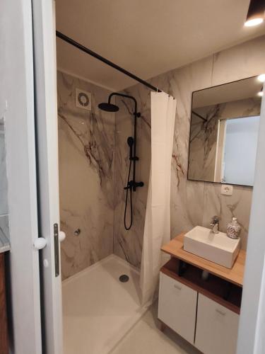 a bathroom with a shower and a sink at Luminaria Solis kuća za odmor in Rogoznica