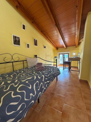 a bedroom with a bed and a wooden ceiling at Villa Rueda in Moratalla