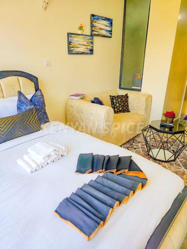 a living room with two beds and a couch at Bohen BnB 2 in Ongata Rongai 