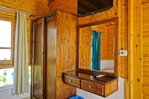 a bathroom with a sink and a mirror at Club Red Dahab Motel in Dahab