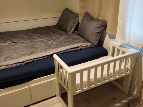 a bed with two pillows on top of it at Brīvdienu māja in Jelgava
