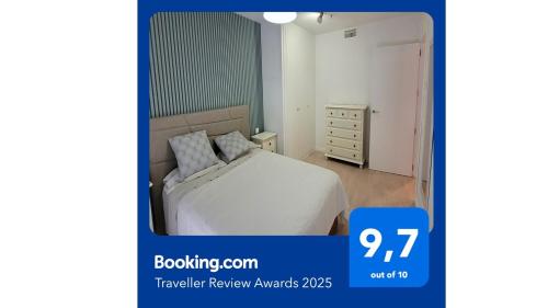 a picture of a bedroom with a bed and a dresser at RIVAS FCA-PARIS TERRAZA apt in Rivas-Vaciamadrid