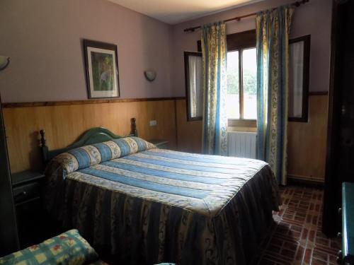 Ένα ή περισσότερα κρεβάτια σε δωμάτιο στο Posada La Ceña