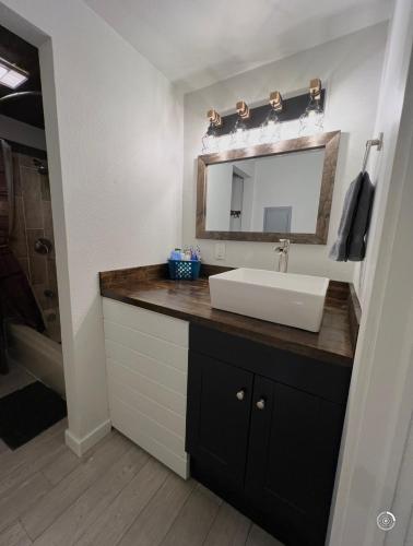 a bathroom with a sink and a mirror at Powder and Paddle in McCall