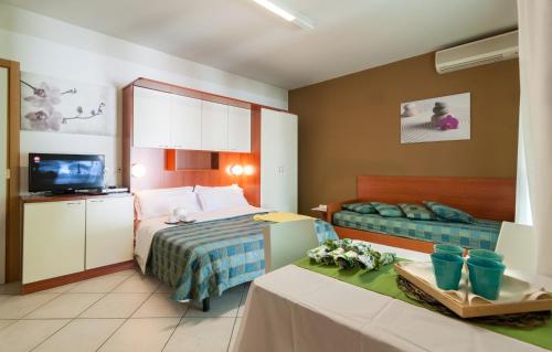 Cama ou camas em um quarto em Riviera Residence