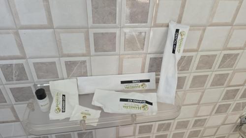 a shelf in a bathroom with toiletries on it at Hame Lana Resort in Mawlynnong