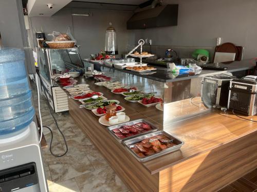 a buffet line with many different types of food at Barış hotel in Alasehir