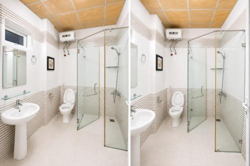 a bathroom with two sinks and two toilets at Loankim Homestay in Hue