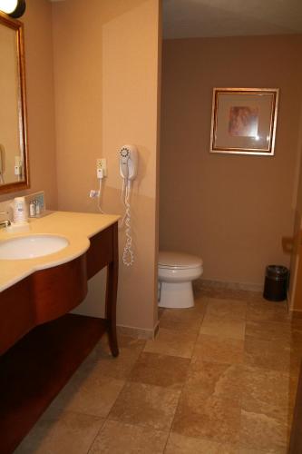 a bathroom with a sink and a phone on the wall at McKnight Hotel in Pittsburgh