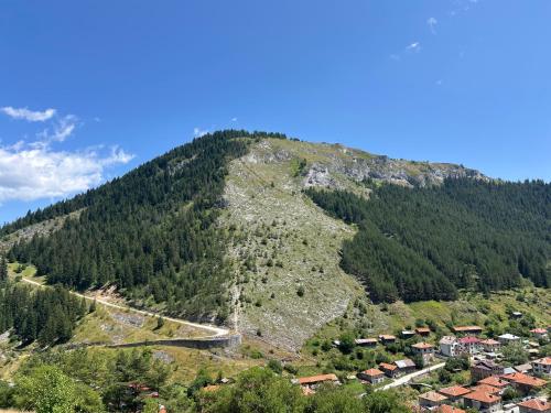 a mountain with a road on top of it at Къща за гости Изгрев in Trigrad