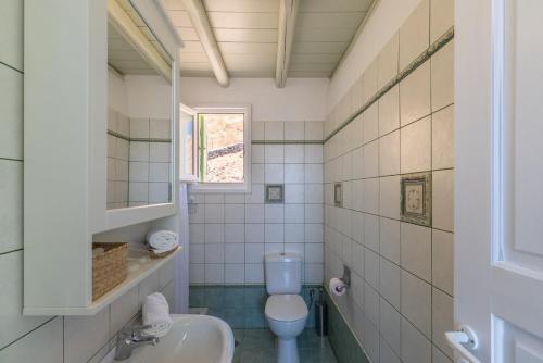 a bathroom with a toilet and a sink at Serifos View in Serifos Chora
