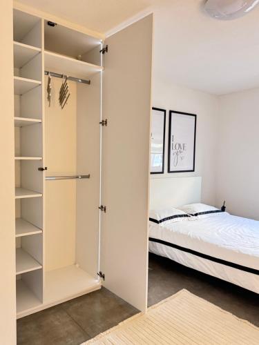 a bedroom with a closet and a bed at Exclusive Una 4 in Bihać