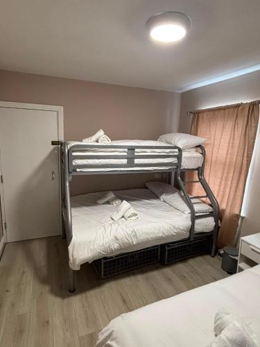 a room with two bunk beds and a window at Shamrock Quay in Cork